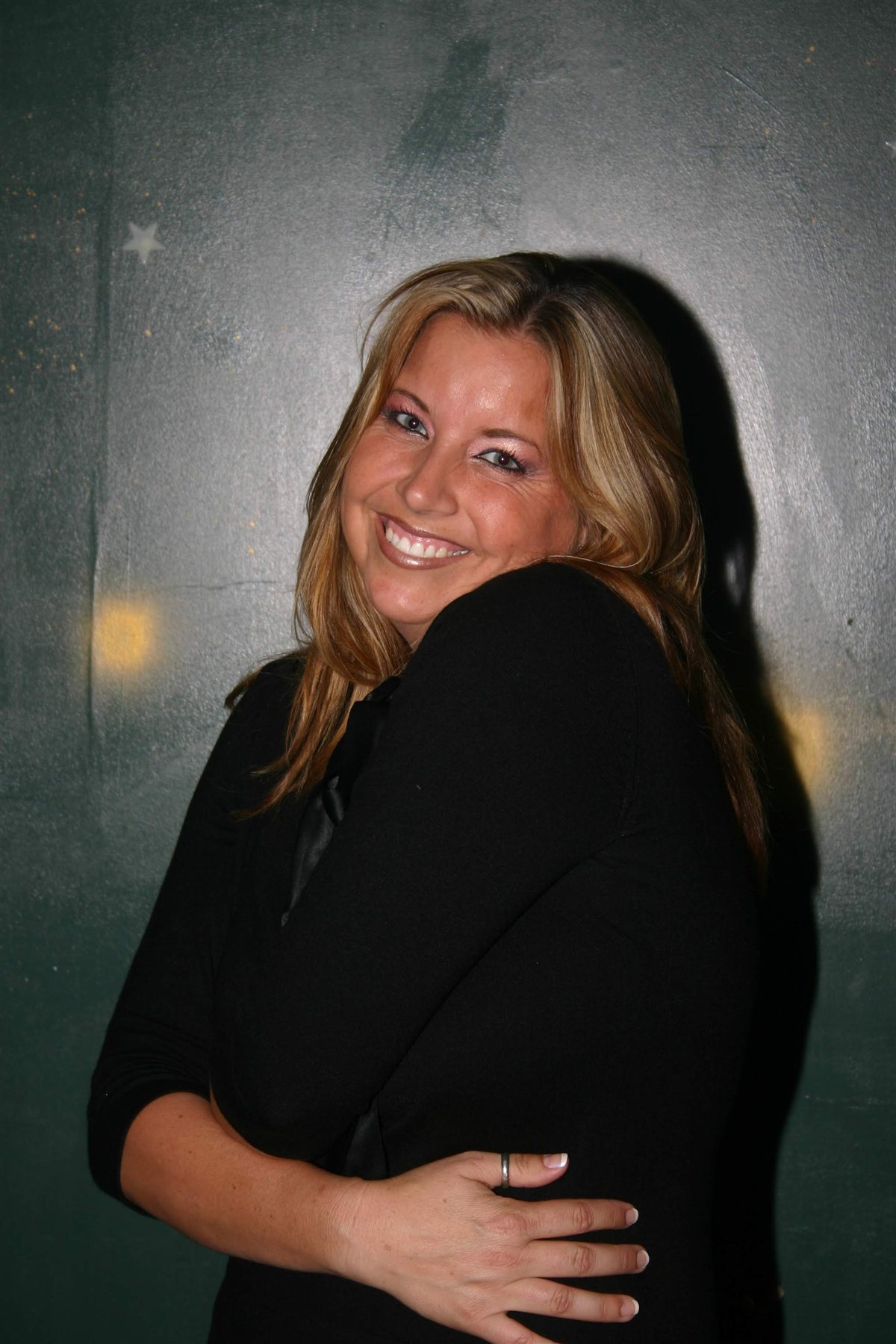 Mary leaning against wall