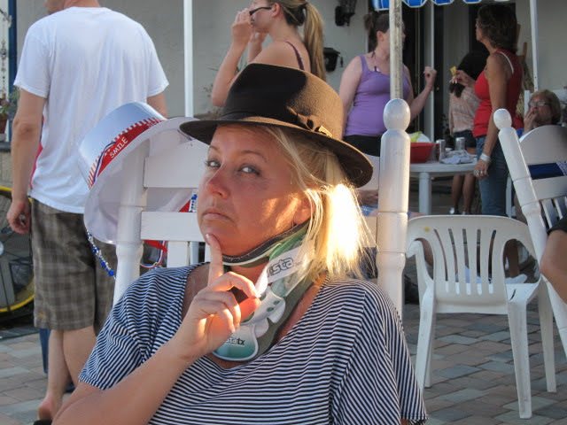 Mary in fedora thinking